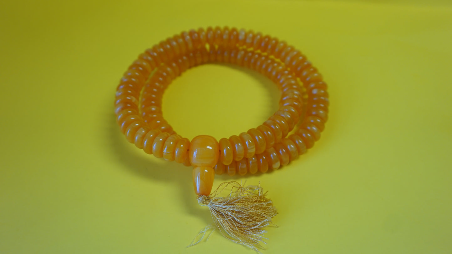 Disc shaped Gold Mala bead.
