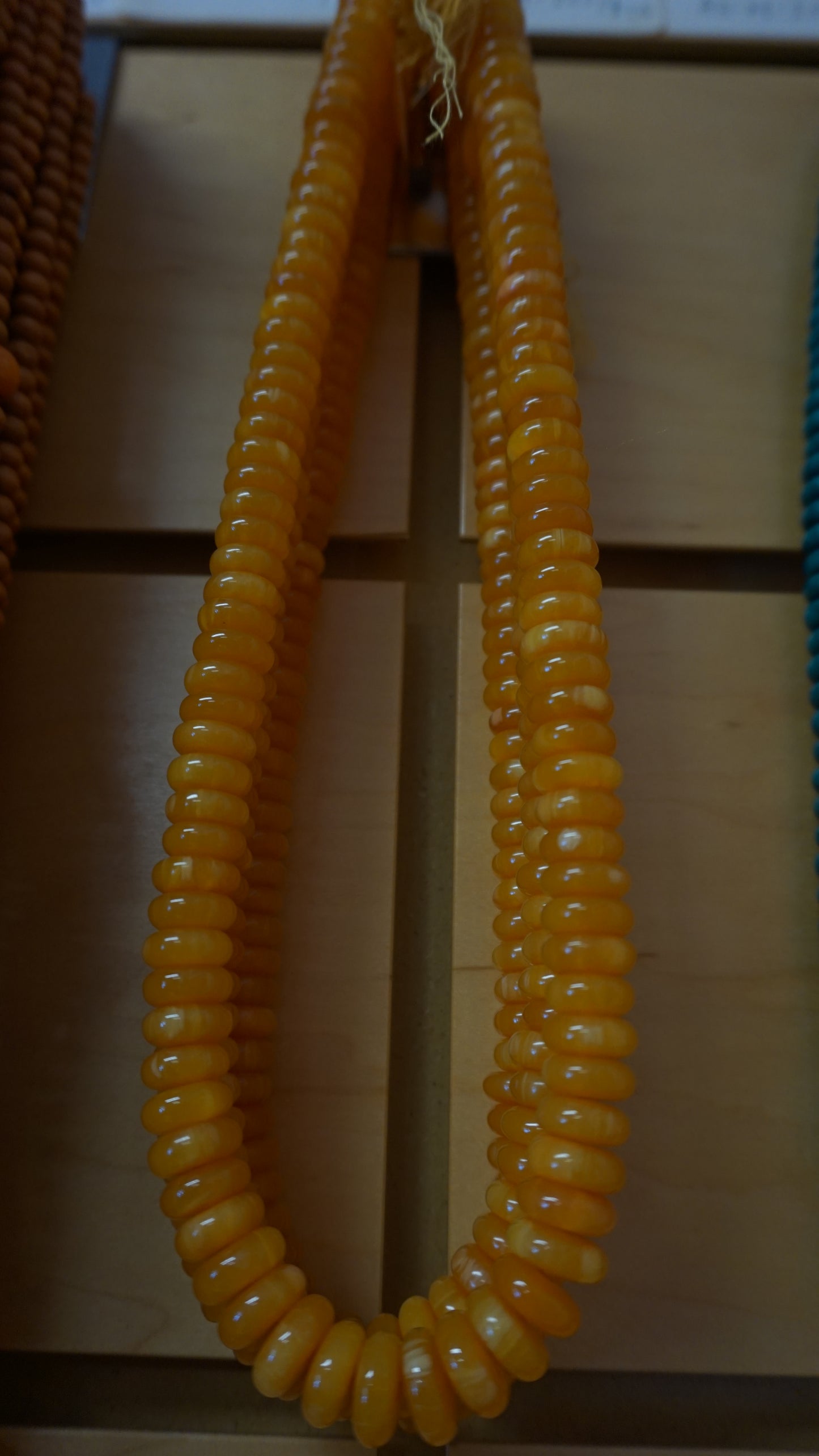 Disc shaped Gold Mala bead.