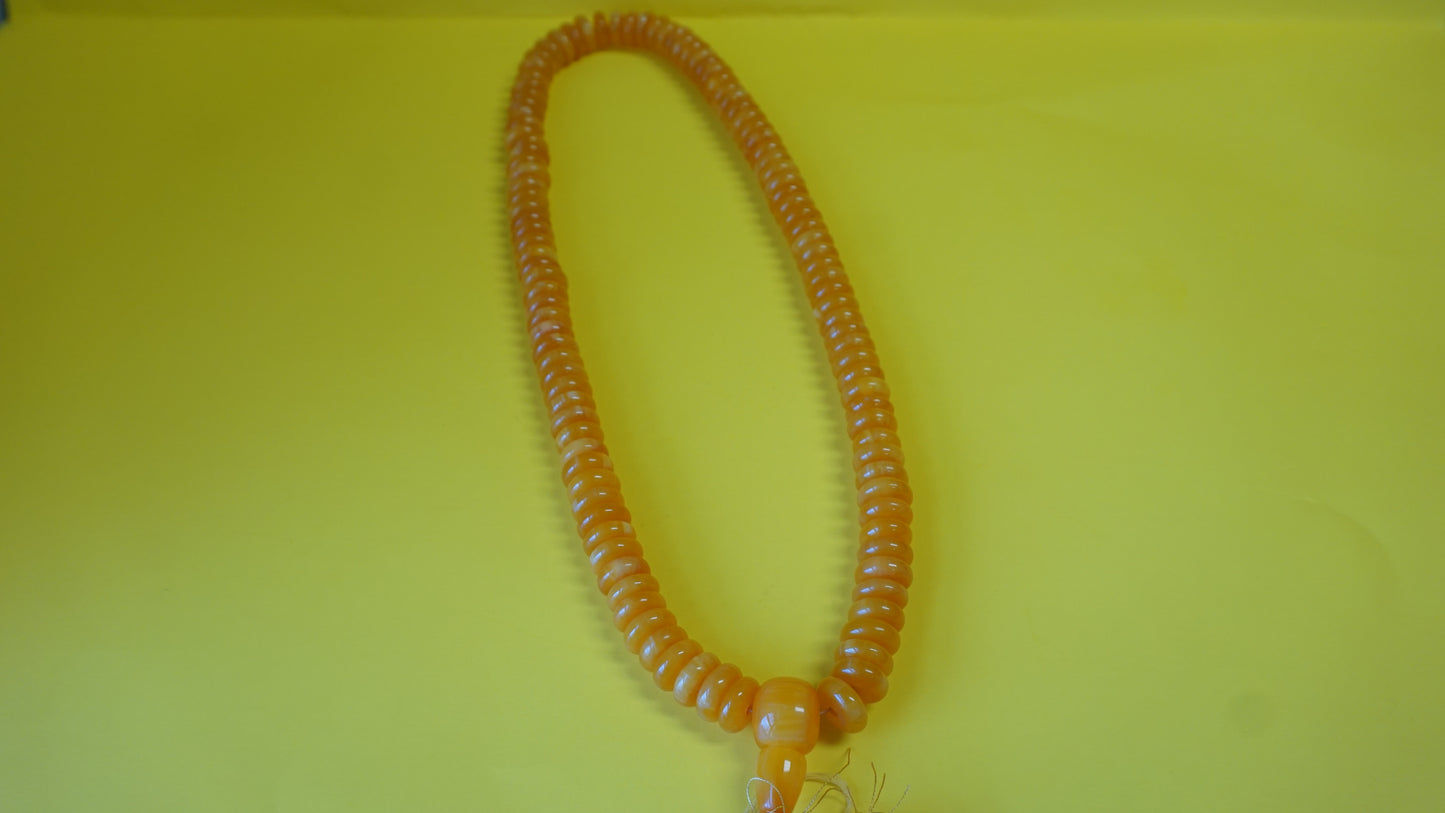 Disc shaped Gold Mala bead.