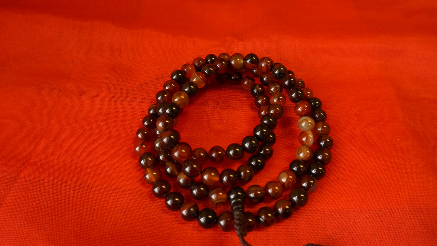 Large Dark Brownish Smooth Glass Mala.