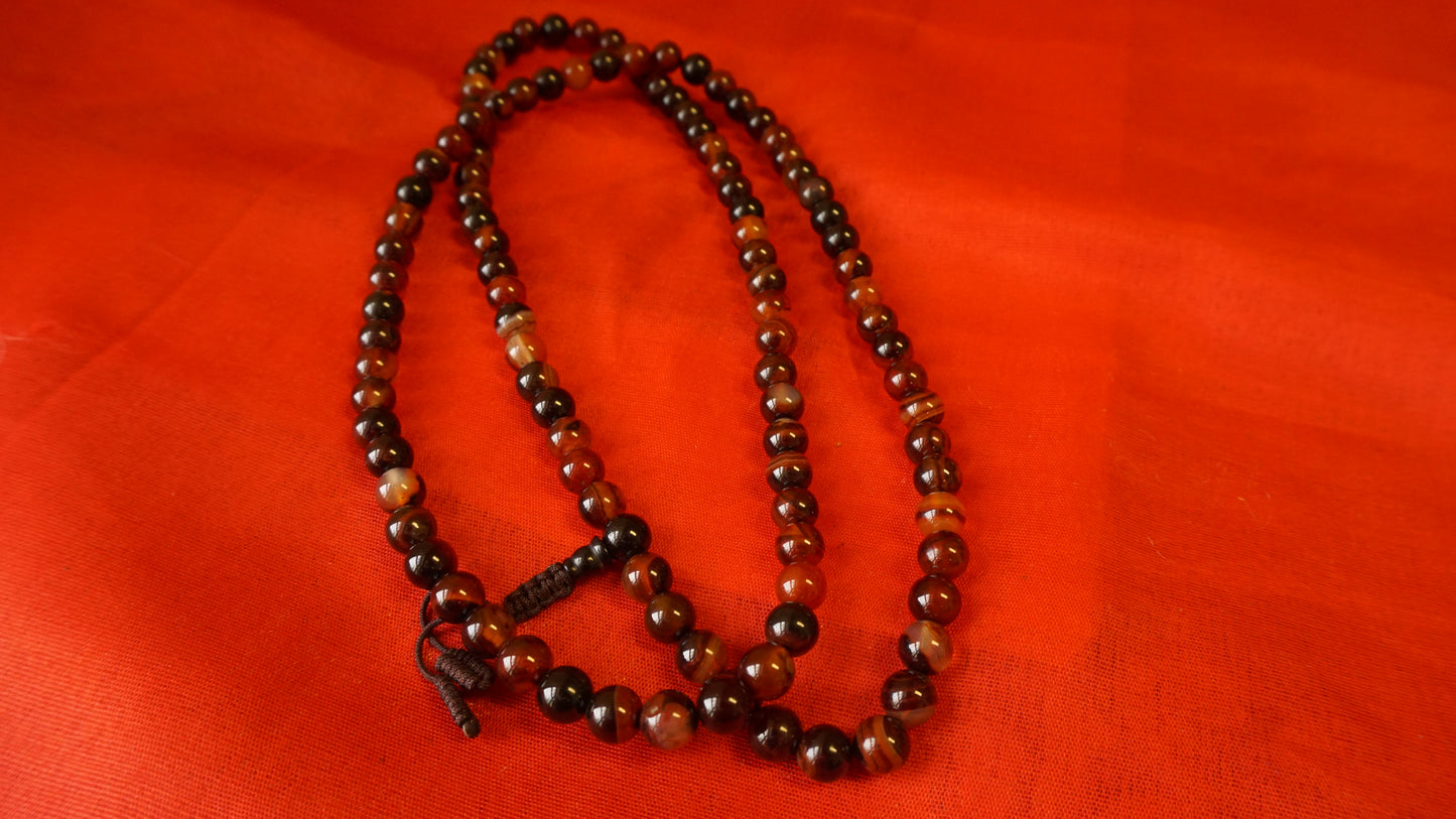 Large Dark Brownish Smooth Glass Mala.