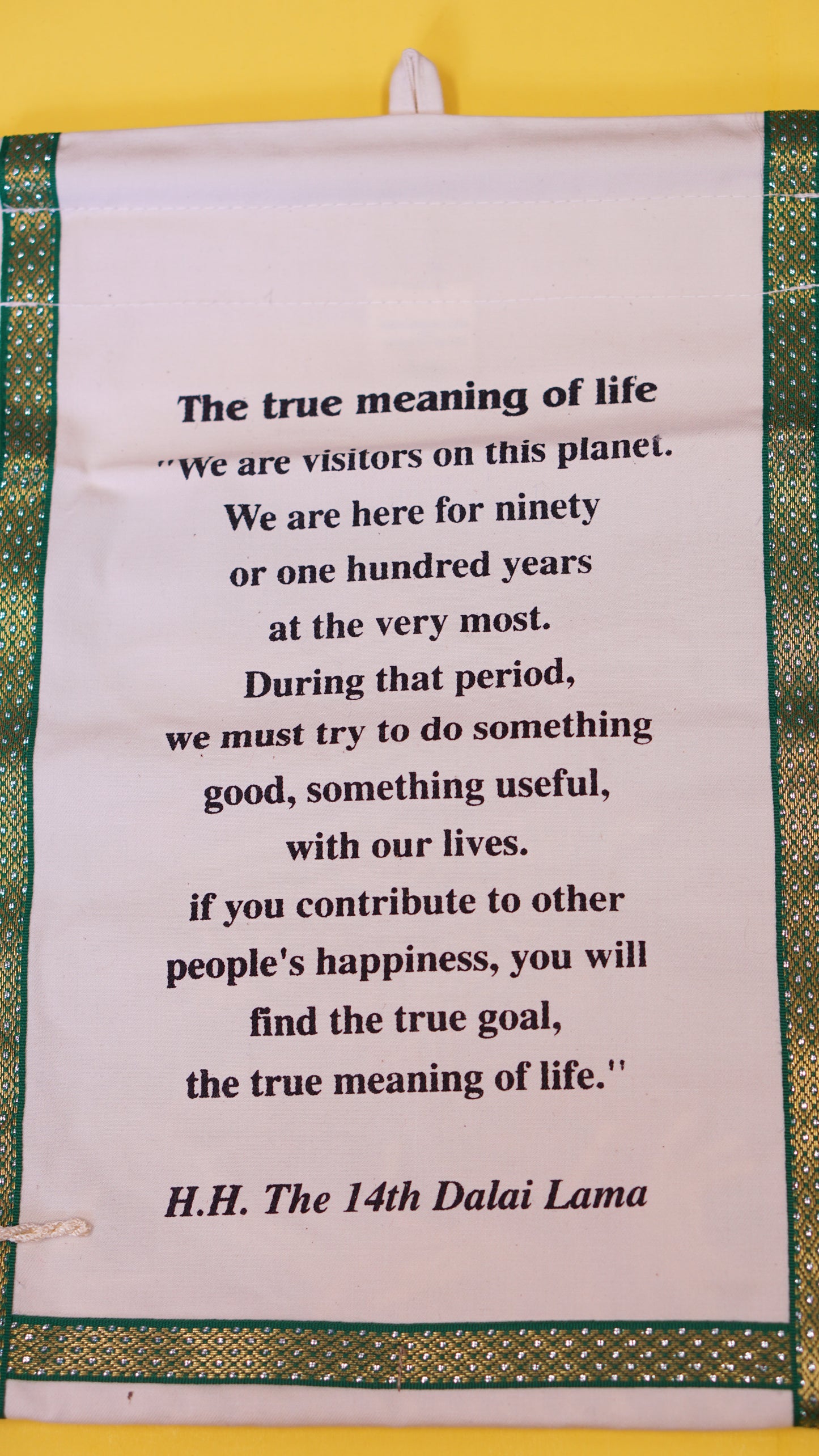 Two pocket decorative wall hanging with His Holiness the Dalai Lama's quote.