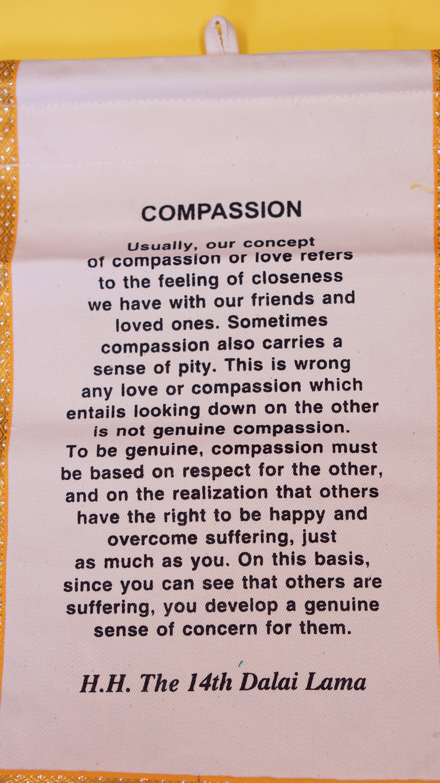 Two pocket decorative wall hanging with His Holiness the Dalai Lama's quote.