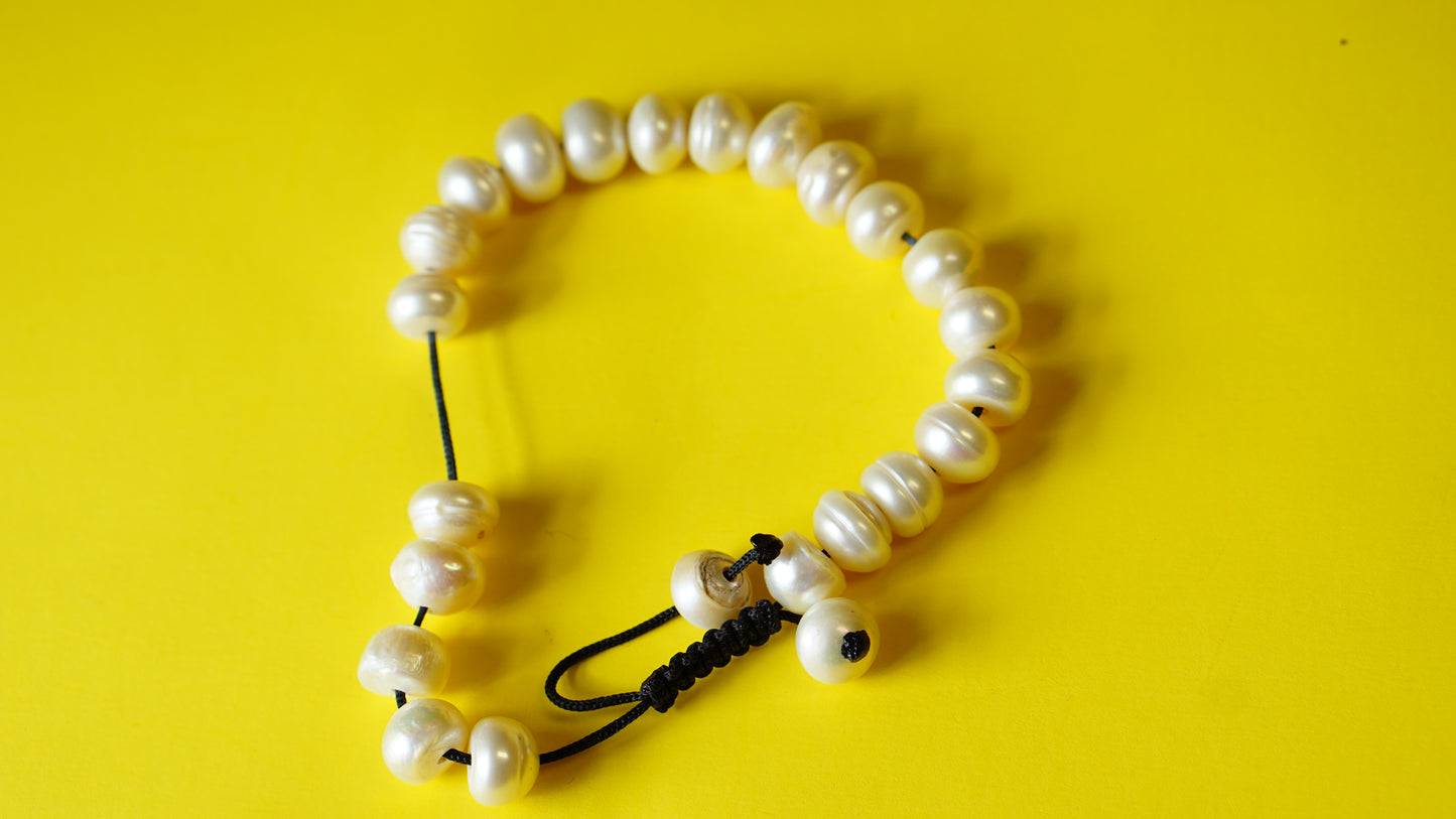 Adjustable White Bamboo Coral Smooth Round Beads.